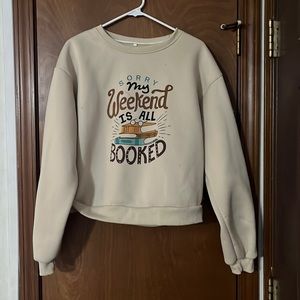 tan sweatshirt with writing